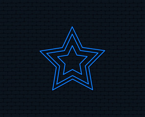 Neon light. Star sign icon. Favorite button. Navigation symbol. Glowing graphic design. Brick wall. Vector
