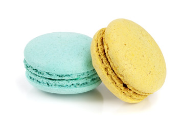 blue and yellow macaroon isolated on white background closeup