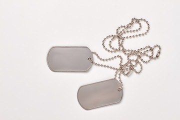 Military dog tags isolated on white background. Blank army dogtags with copyspace.