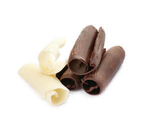 Different delicious chocolate curls on white background