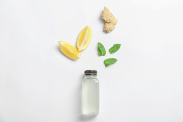 Flat lay composition with delicious natural lemonade on white background