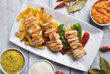 Grilled chicken meat on skewer