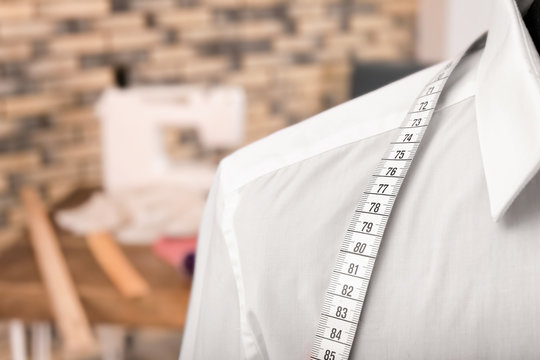 Mannequin with measuring tape in tailor studio, closeup