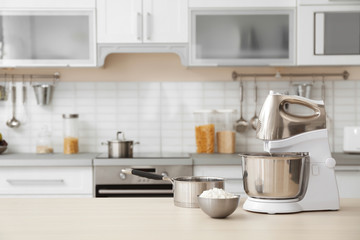 Fototapeta na wymiar Houseware and blurred view of kitchen interior on background