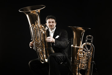 Tuba brass instrument. Classical musician portrait