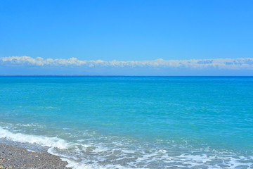 Fototapeta premium summer landscape sea view at a pebble beach