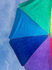 Colorful parasol against the sky