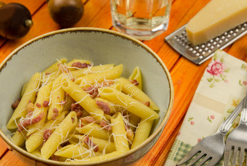 Pasta carbonara. Italian pasta with bacon. Penne alla carbonara