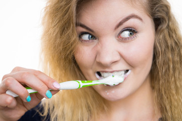 Woman brushing cleaning teeth