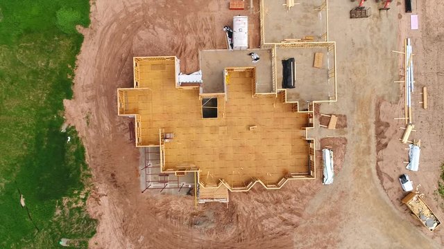 New home construction with floor and framing,  aerial view.
