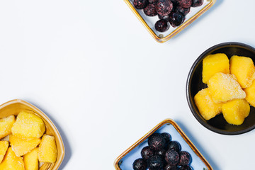 Mango cubes and blueberry in bowl