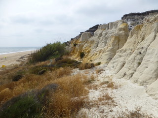 Playa Cuesta Maneli en Huelva, zona costera con playa de arena fina blanca que forma parte del...