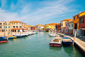 Fototapeta na wymiar Colorful buildings and canal in Murano island, Venice, Italy
