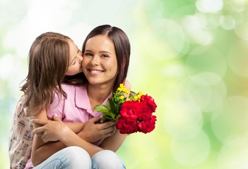 Happy Mother and daughter with flower