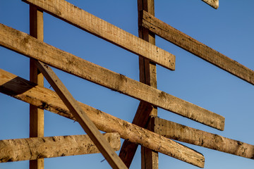 wooden fence against the blue sky