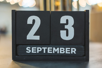 Calendar and wooden cubes. 23 (twenty-third) September