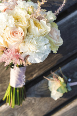 Beautiful pastel bridal bouquet and boutonniere