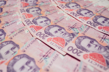 Modern Ukrainian money background - hryvnia. 200  banknotes. UAH. Money concept