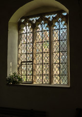 View from inside old church to blossom tree outside