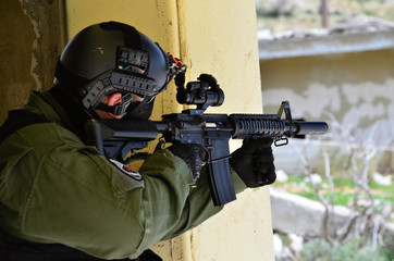 Red dot on rifle soldier aim