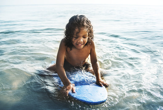 Little kid playing at the beach