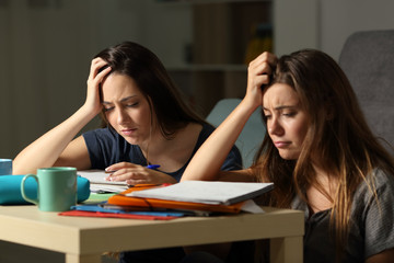 Frustrated students studying late hours in the night