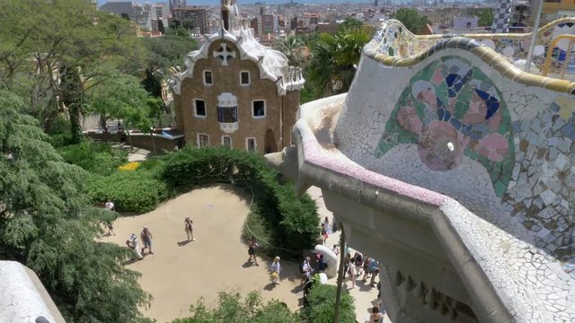 Tilt up view from bench Mosaics to Barcelona's skyline as seen from Park Guell