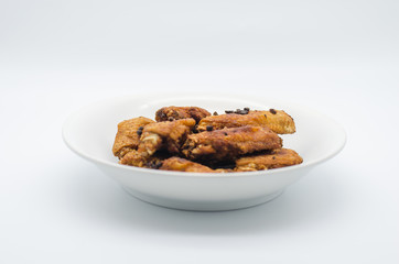 Fried chicken on white plate with white background, asia food, unhealthy food