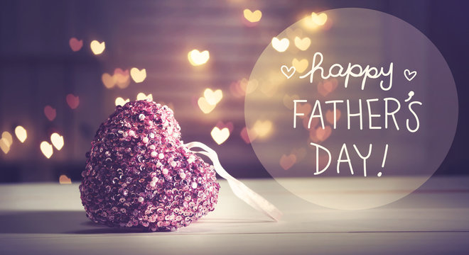 Happy Father's Day message with a pink heart with heart shaped lights