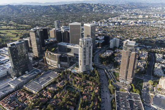 Los Angeles Century City Skyline Aerial View With Beverly Hills And The Santa Monica Mountains In Background.