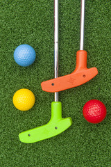 Colorful Putt Putt clubs and Balls