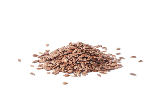 pile of flax seeds isolated on white background
