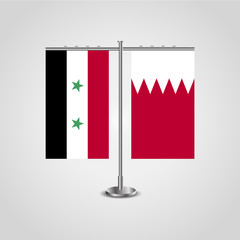 Table stand with flags of Syria and Bahrain.Two flag. Flag pole. Symbolizing the cooperation between the two countries. Table flags