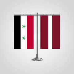 Table stand with flags of Syria and Latvia.Two flag. Flag pole. Symbolizing the cooperation between the two countries. Table flags