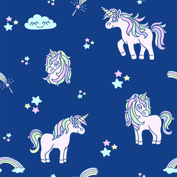 Pink unicorns on the navy blue seamless pattern