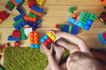 baby playing with toy blocks