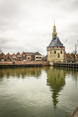 Obraz premium Clock tower building in the harbor town of Hoorn, Netherlands