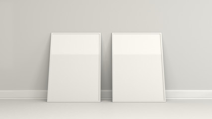 Blank white poster in white frame standing on the floor