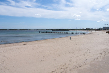 Fototapeta na wymiar beach on the baltic sea with a view of two wooden bridges