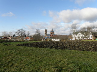 Architecture, building, building exterior, built structure, cloud sky, day, environment, Field, Grass, Land, landscape, Nature, no people, outdoors, Place of worship, Plant, religion, residential dist