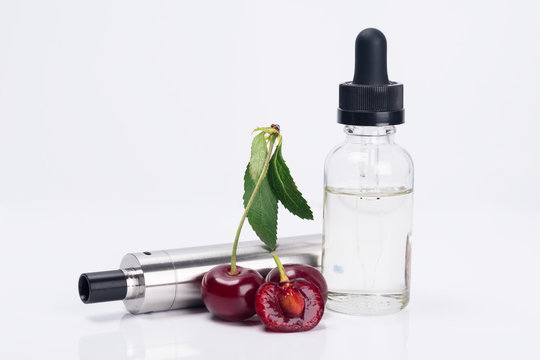 electronic cigarette and liquid for refueling with cherry flavor on a white background