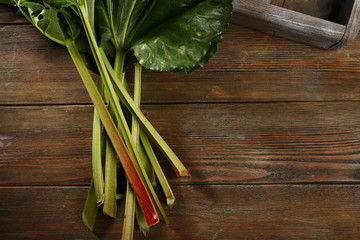 Wooden background with rhubarb