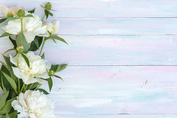 Peonies on a wooden background. Texture. Photo for social networks