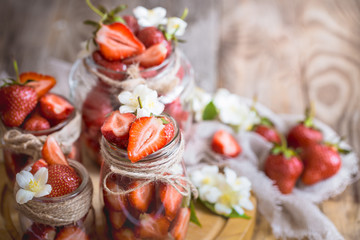 Fresh strawberries in jars