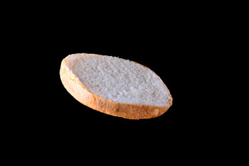 Fototapeta premium Grilled burger bun isolated on black background. Close up