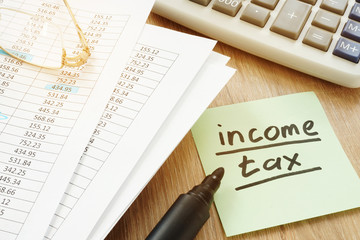 Income tax sign and financial report.