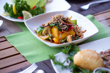 Thai style hot and spicy mixed vegetable and seafood mixed with green pepper, bell pepper and herbs.