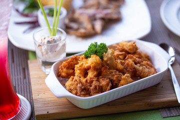 Battered Deep fried calamari squid served with white tartar sauce.