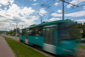 Fototapeta premium The motion of a blurred streetcar in the daytime.