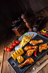 Rustic Grilled chicken wings,legs,and spicy corn
